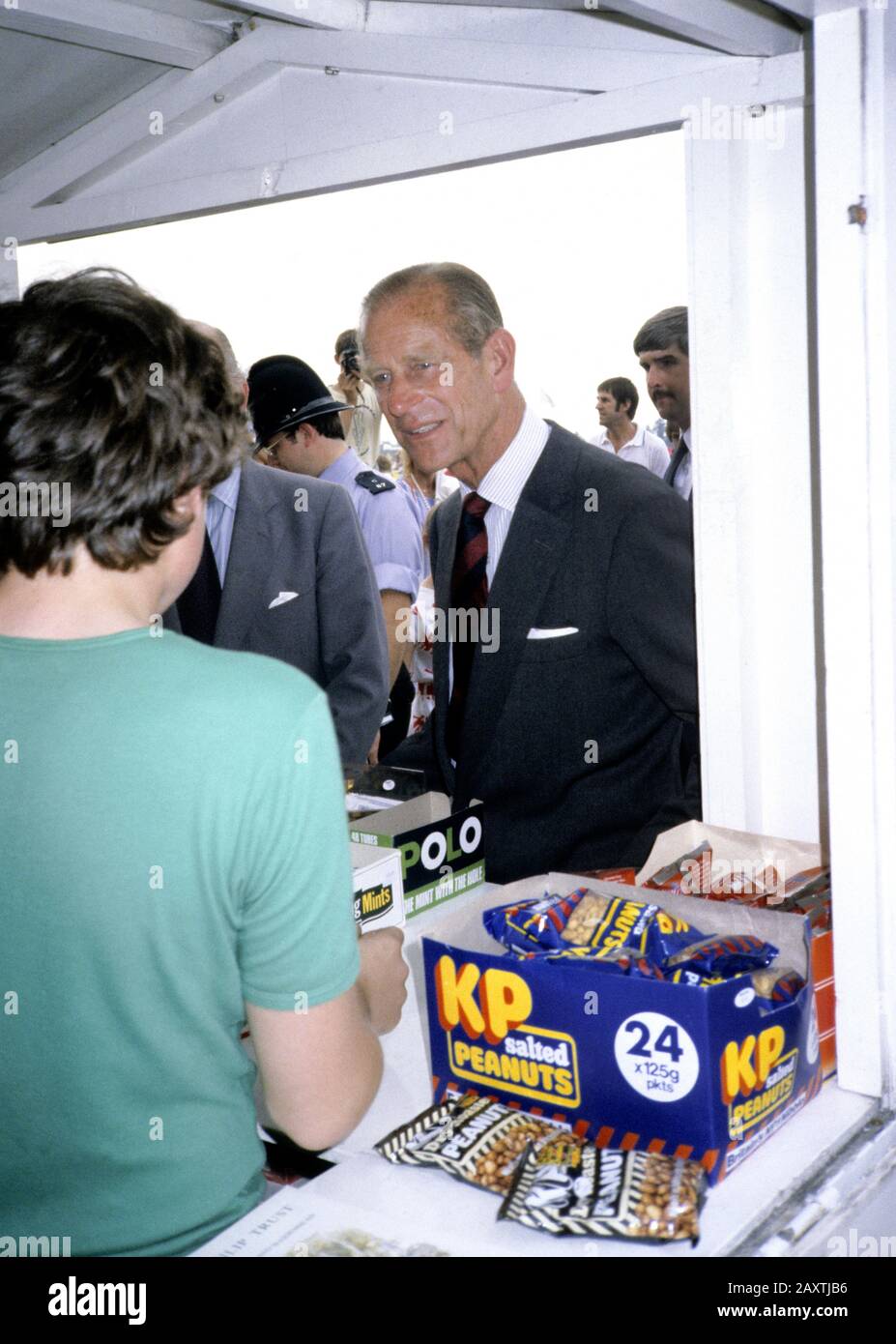 HRH Prince Philip, Duke of Edinburgh buys some KP nuts at Ascot racecourse, England, July 1984 Stock Photo