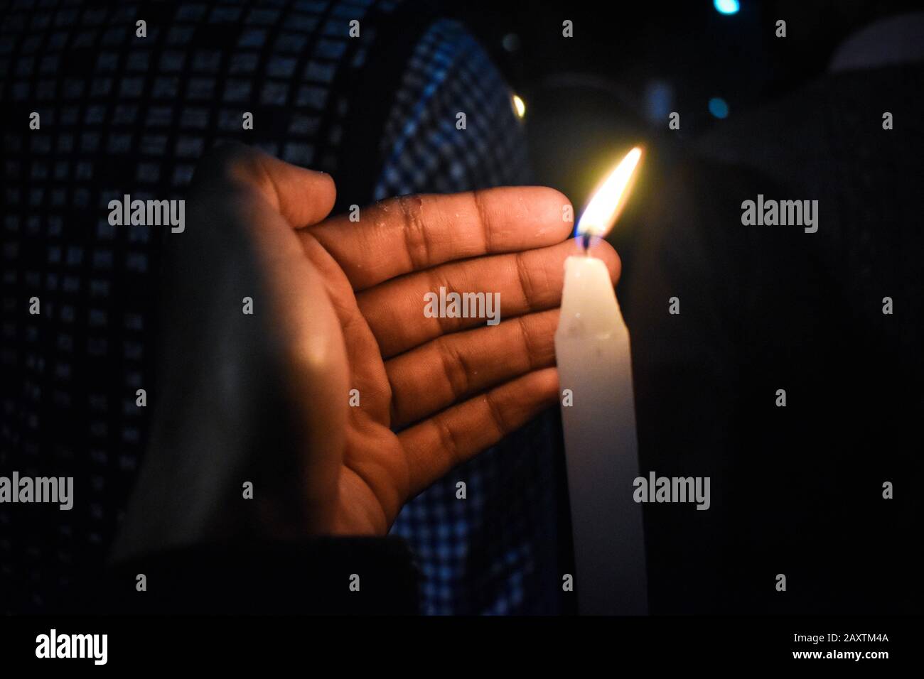 People are showing candle on a candle march rally for against NRC and CAA in Kolkata, India. Stock Photo