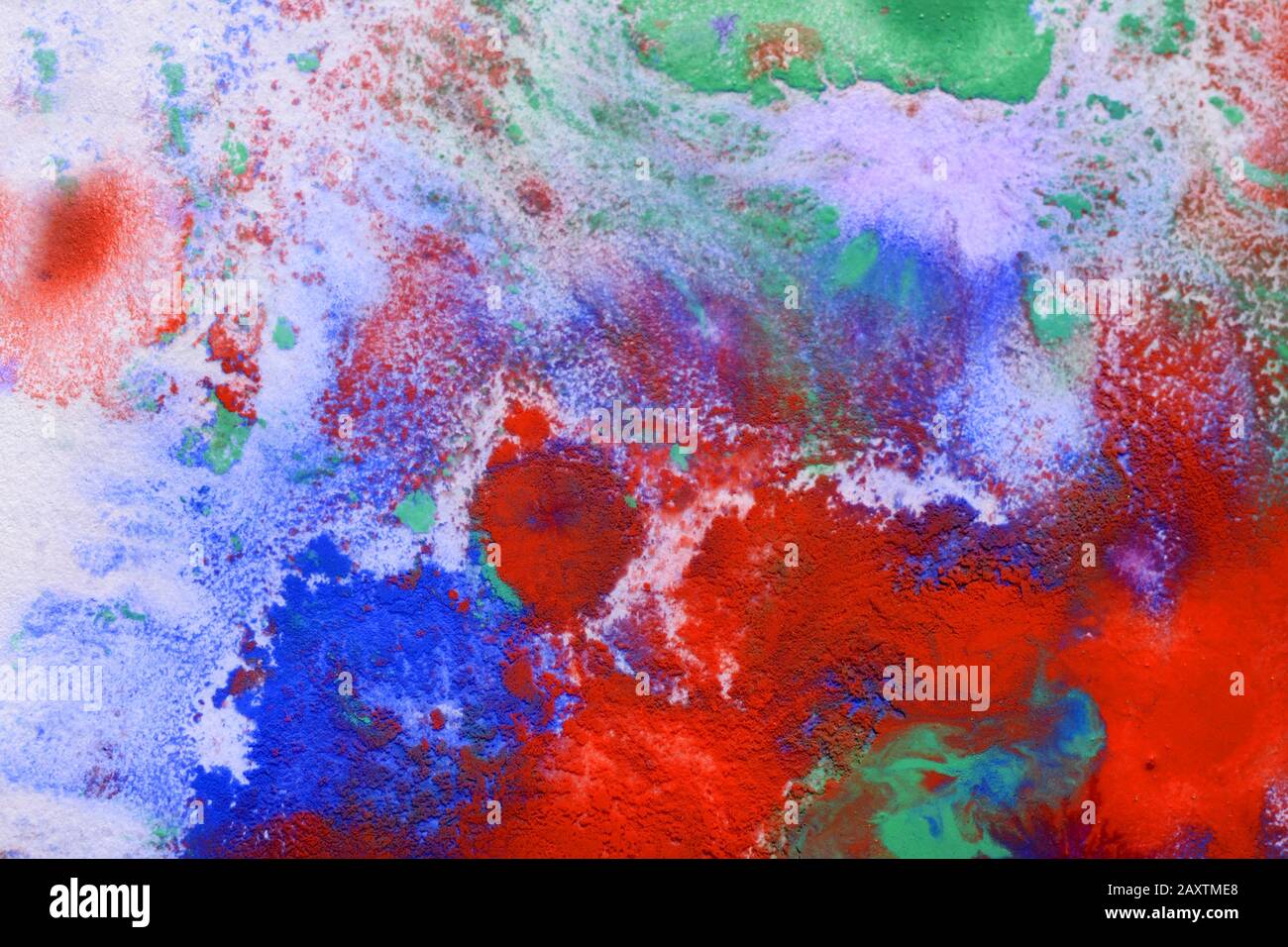 Multicolored paint stains, drips, splashes, mixing. Abstract background Stock Photo