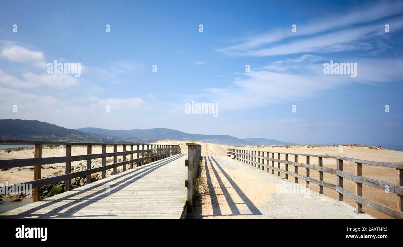 wooden bridge on Baldaio beach. Stock Photo