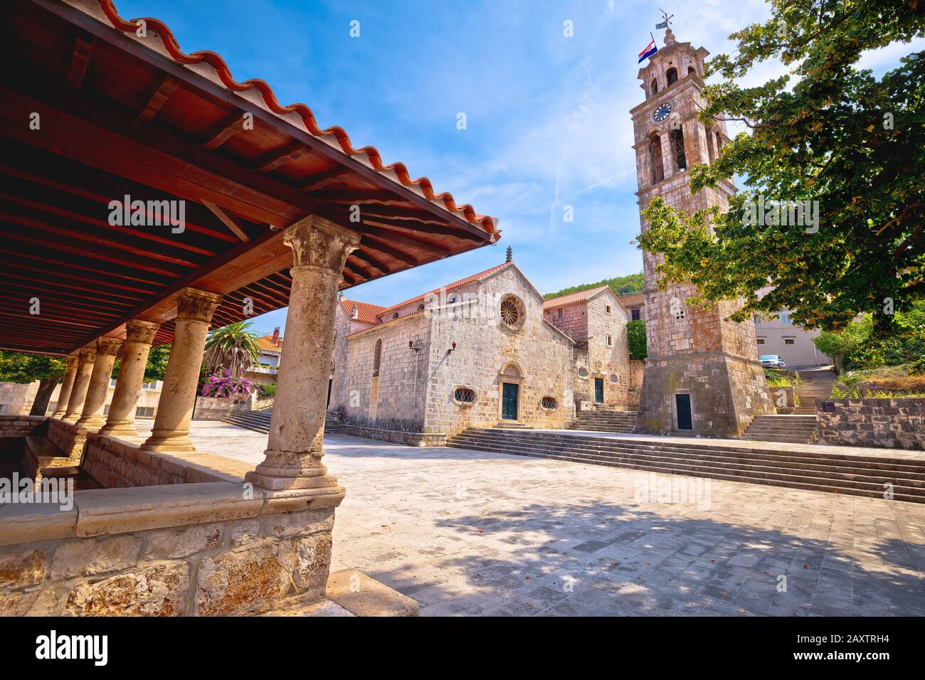 Blato on Korcula island historic stone square town lodge and church view, southern Dalmatia region of Croatia Stock Photo