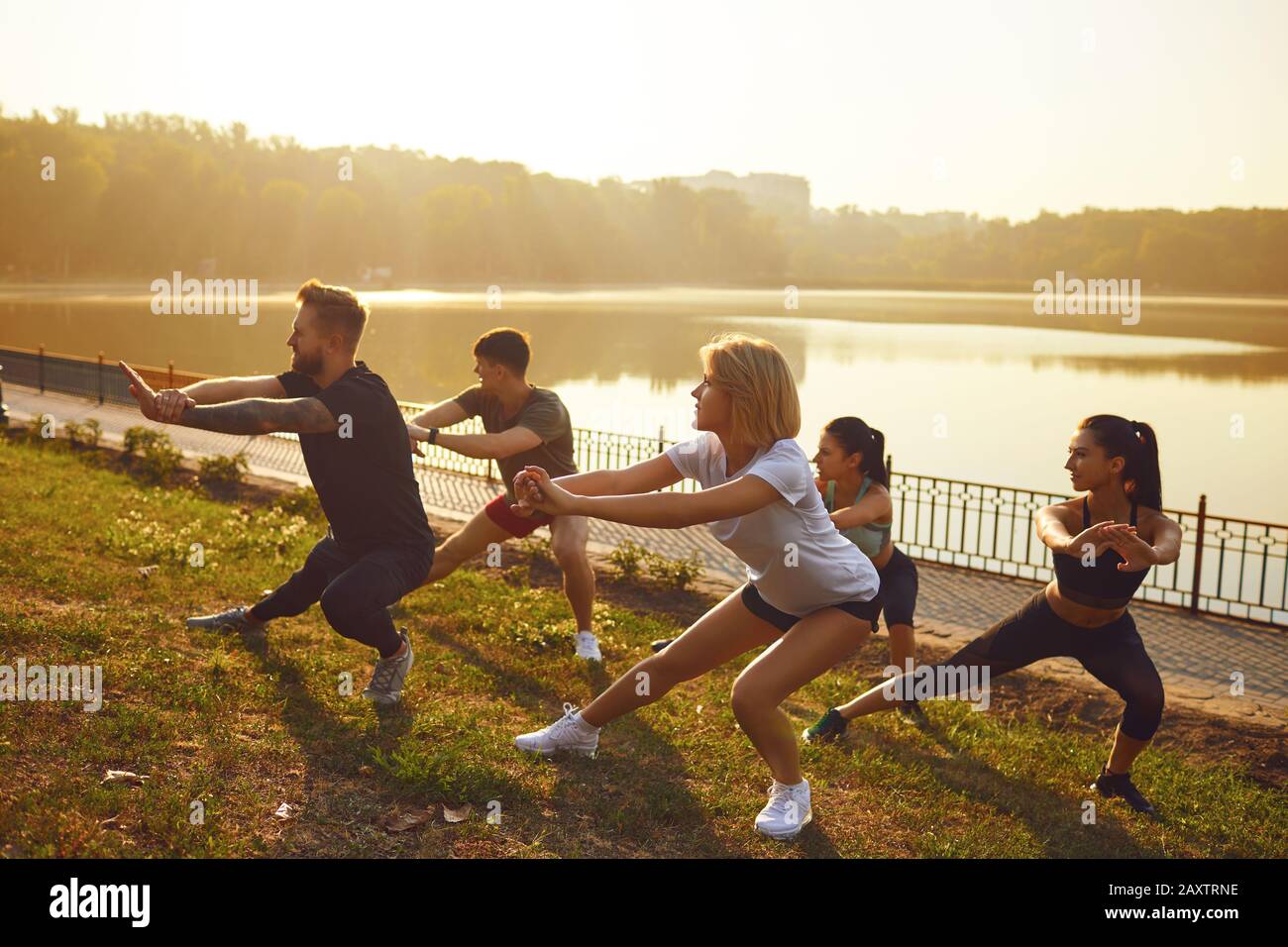 Group of young people at a training session in a park Stock Photo