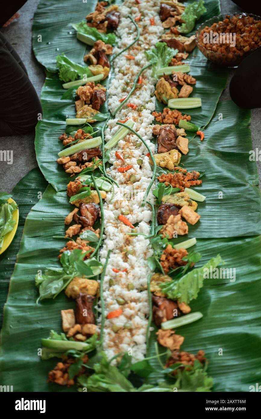 Kembulan Javanese Eating Tradition Rice And Fried Chicken And Sambal Served On Banana Leaf Stock Photo Alamy