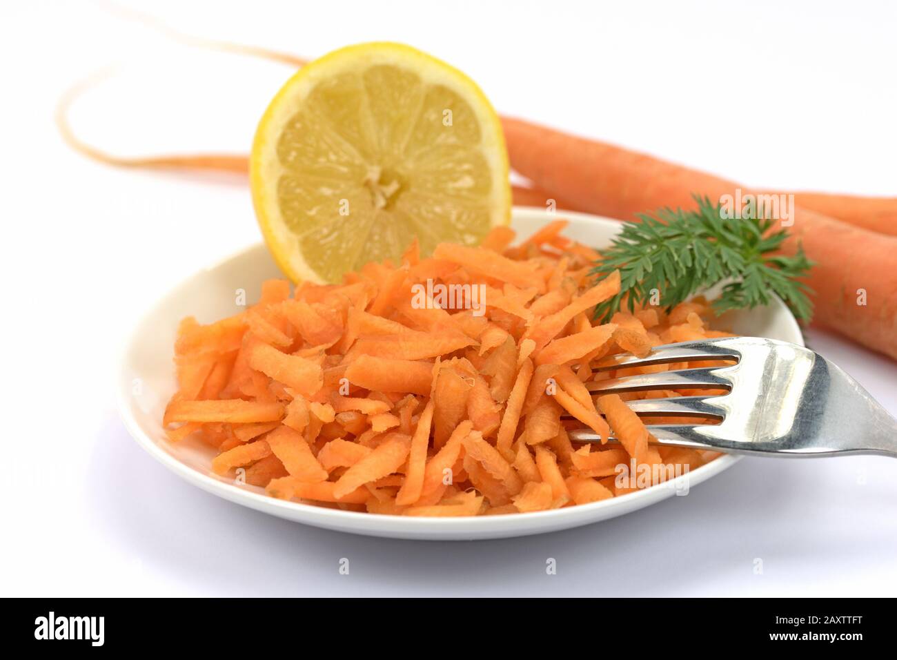 Grated carrots on a plate Stock Photo