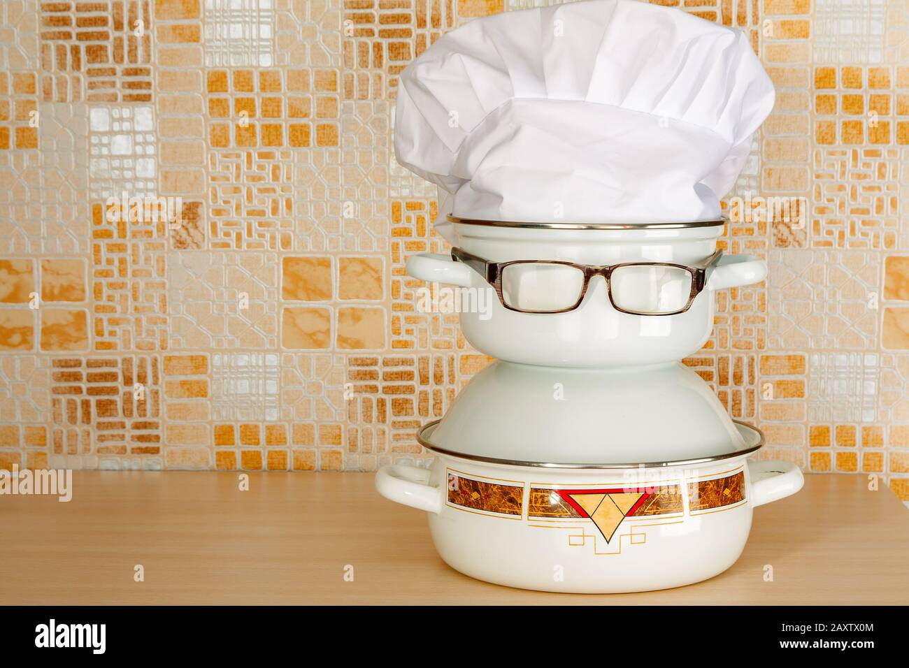 Set of pans with eyeglasses like joke caricature of a cook Stock Photo