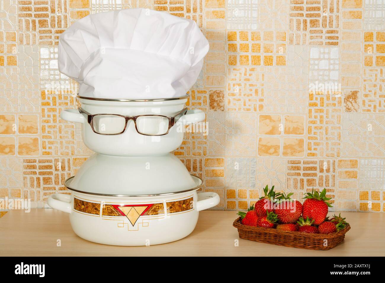 Set of pans with eyeglasses like joke caricature of a cook Stock Photo