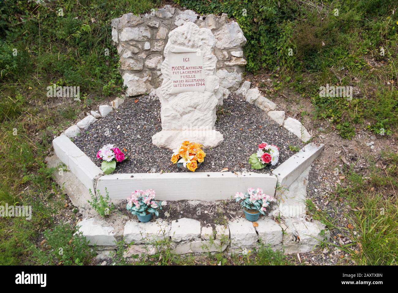 Monument where Monk Anthelme was shot / executed in a cowardly fashion by German Nazis forces in February 1944, during World War Two / 2 / II / WW2 in Ain, France, which was under the authority of Vichy France (112) Stock Photo