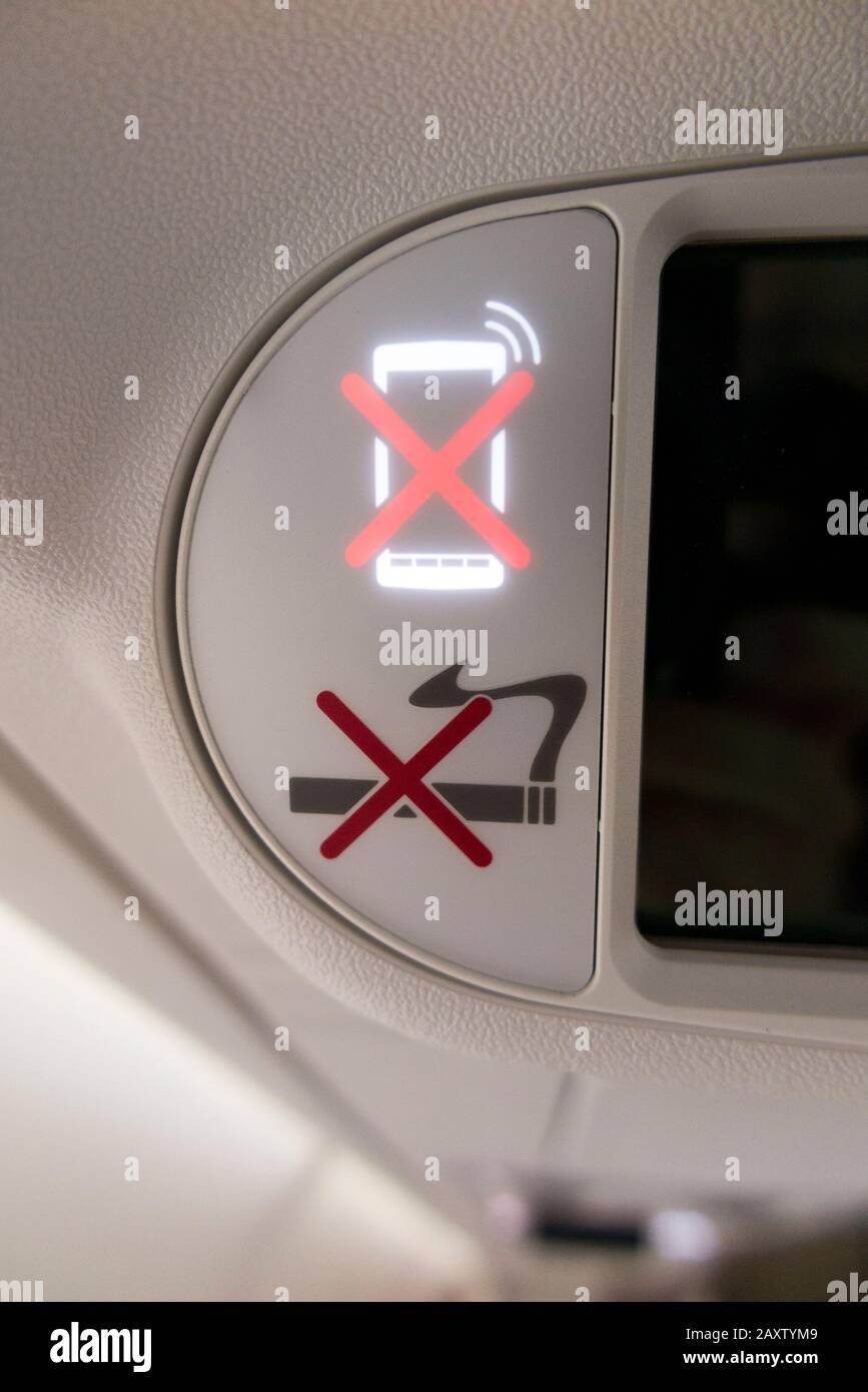 Aircraft "no mobile phone / telephone / electronic device" and "no smoking" overhead light sign