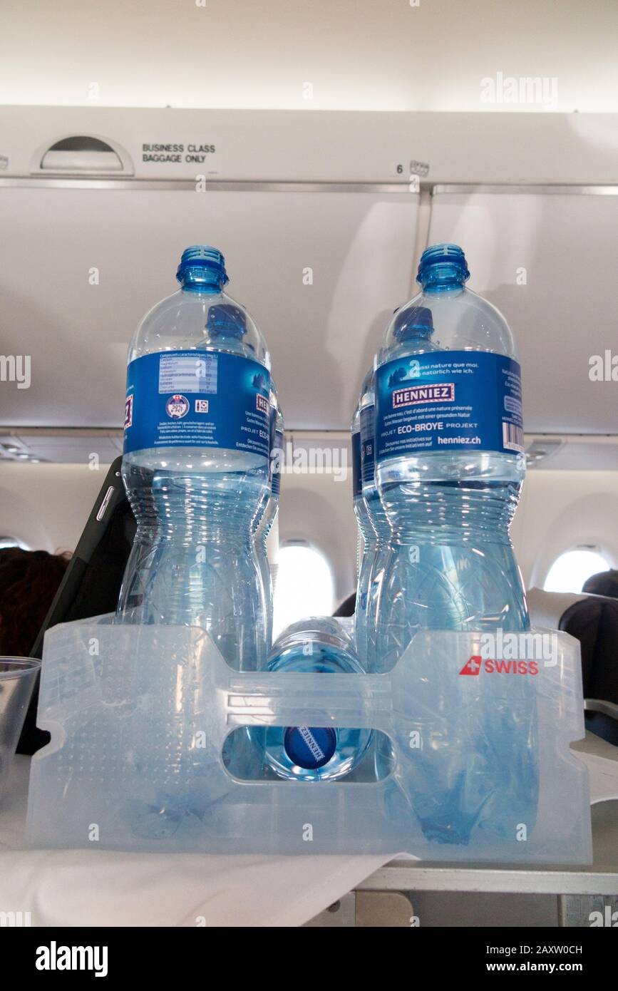Plastic water bottle opened on an aircraft under cabin pressure and crushed  by air pressure on landing UK Stock Photo - Alamy