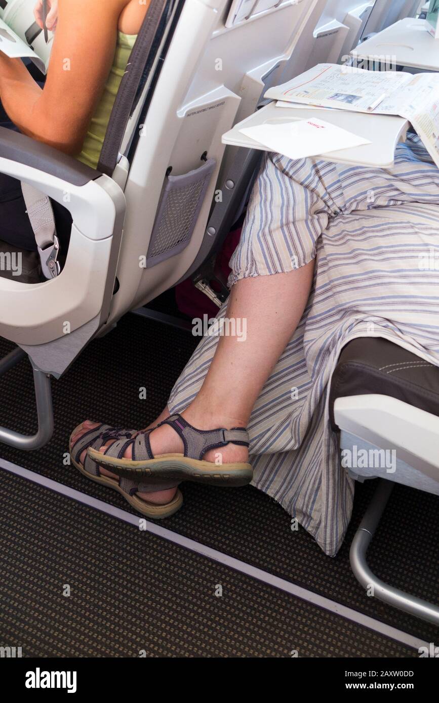 Crossed legs airplane hi-res stock photography and images - Alamy