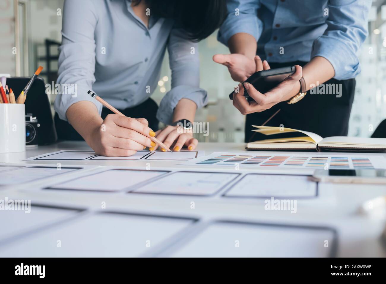 Programmer and UX UI designer working in a software development and coding technologies. Mobile and website design and programing development technolo Stock Photo