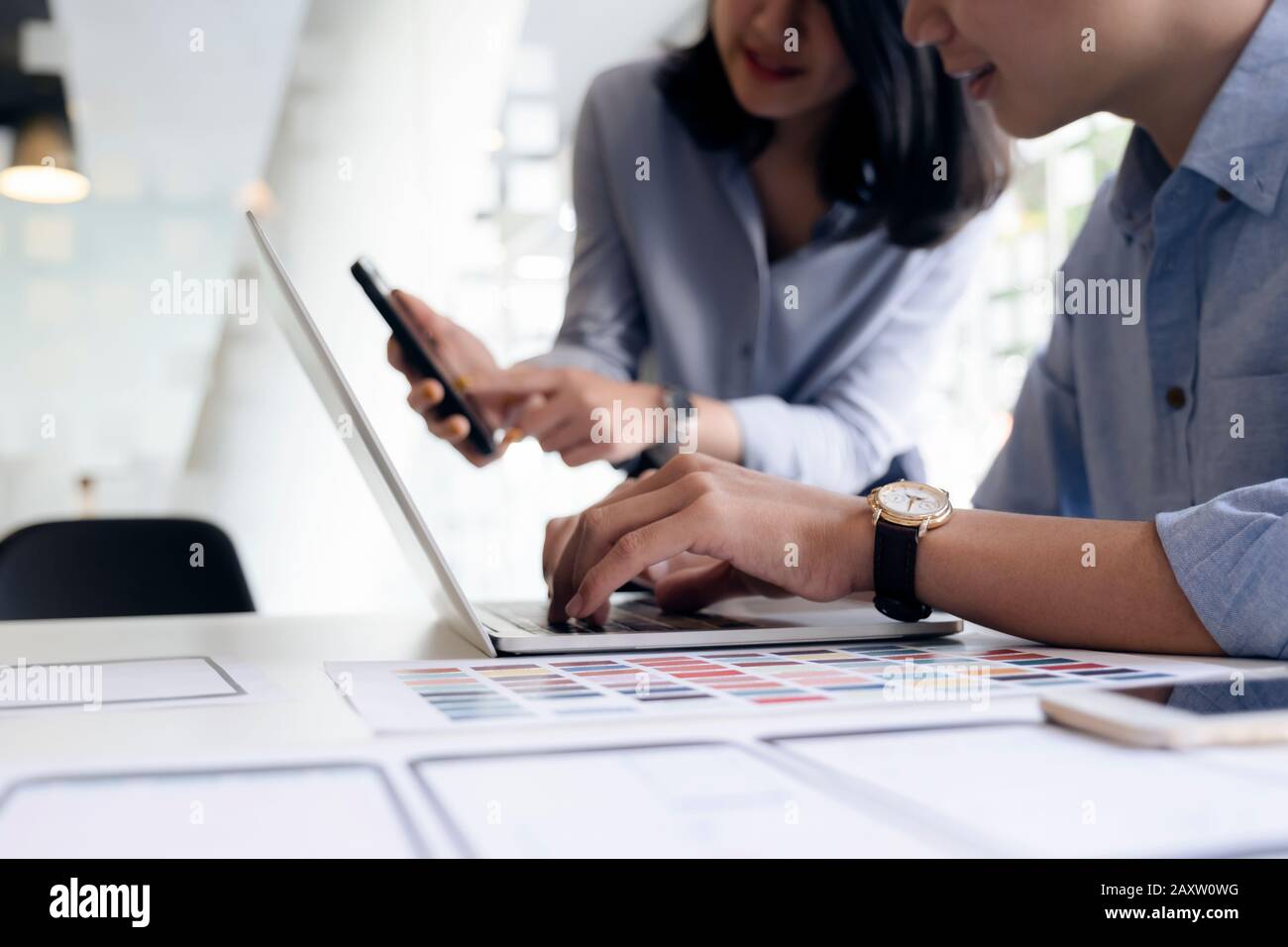 Programmer and UX UI designer working in a software development and coding technologies. Mobile and website design and programing development technolo Stock Photo