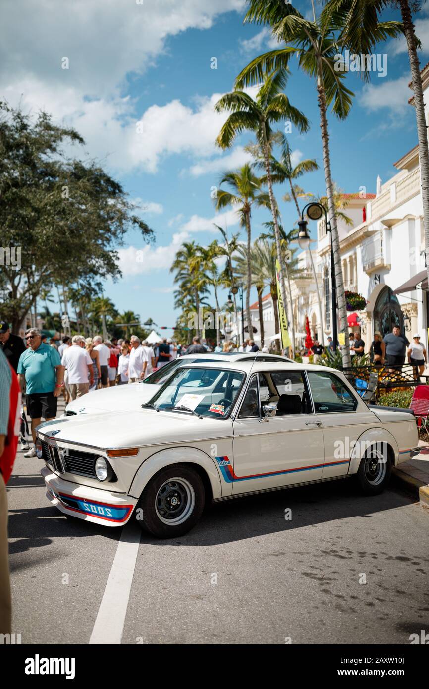 BMW 2002 Turbo, vintage model from 1974 under the Florida palm trees
