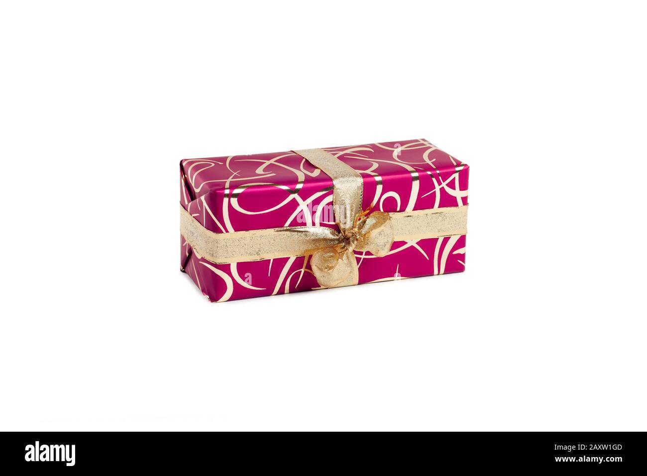 packaged rectangular gift in dark pink packaging with gold bow and gold pattern on a white background Stock Photo