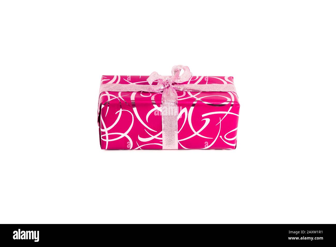 packaged rectangular gift in pink packaging with gold bow and gold pattern on a white background Stock Photo