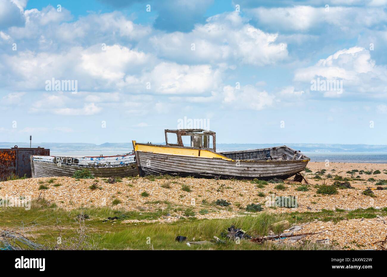 Decaying hull of old wooden fishing boats abandoned on the shingle ...