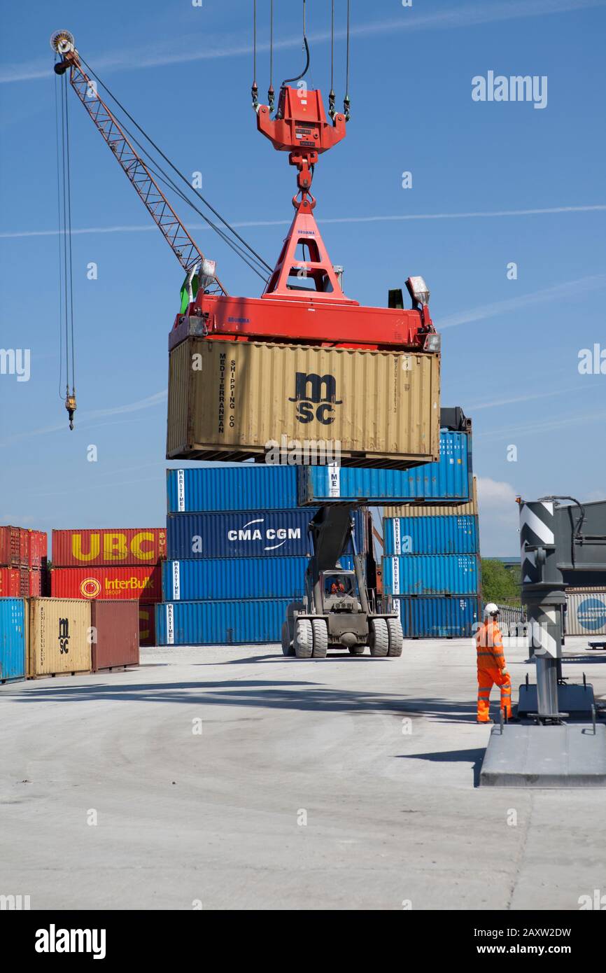 Crane lifting container loading and unloading Stock Photo