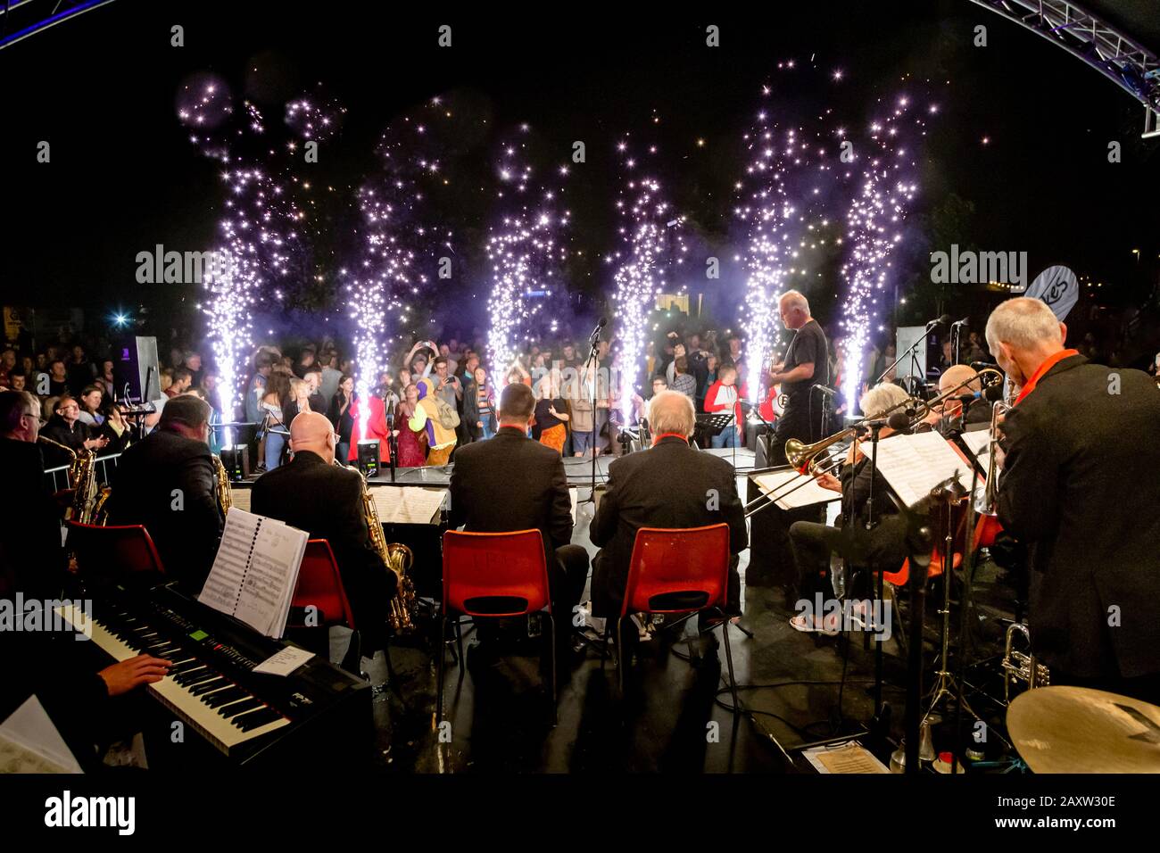 Taverners big band shot from behind with fireworks pyrotechnics on front of stage at Stompin on the Quomps Stock Photo