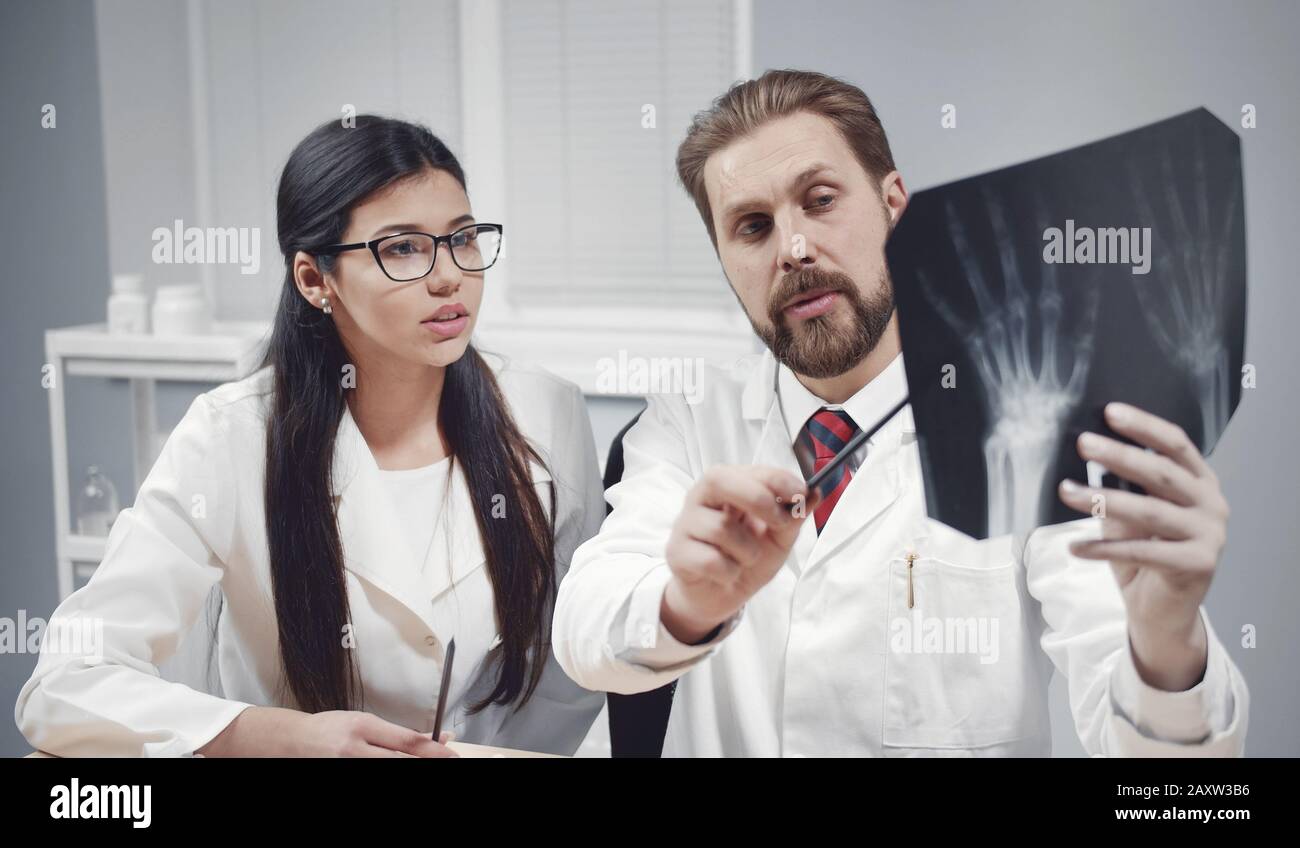 Doctors discussing x-ray image Stock Photo