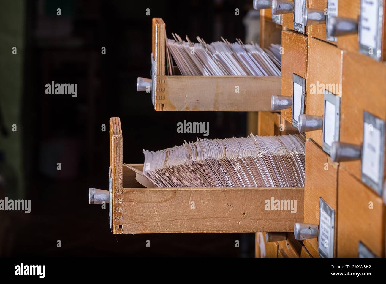 Old library or archive reference catalogue with  opened card drawer. Database and knowledge catalog concept Stock Photo
