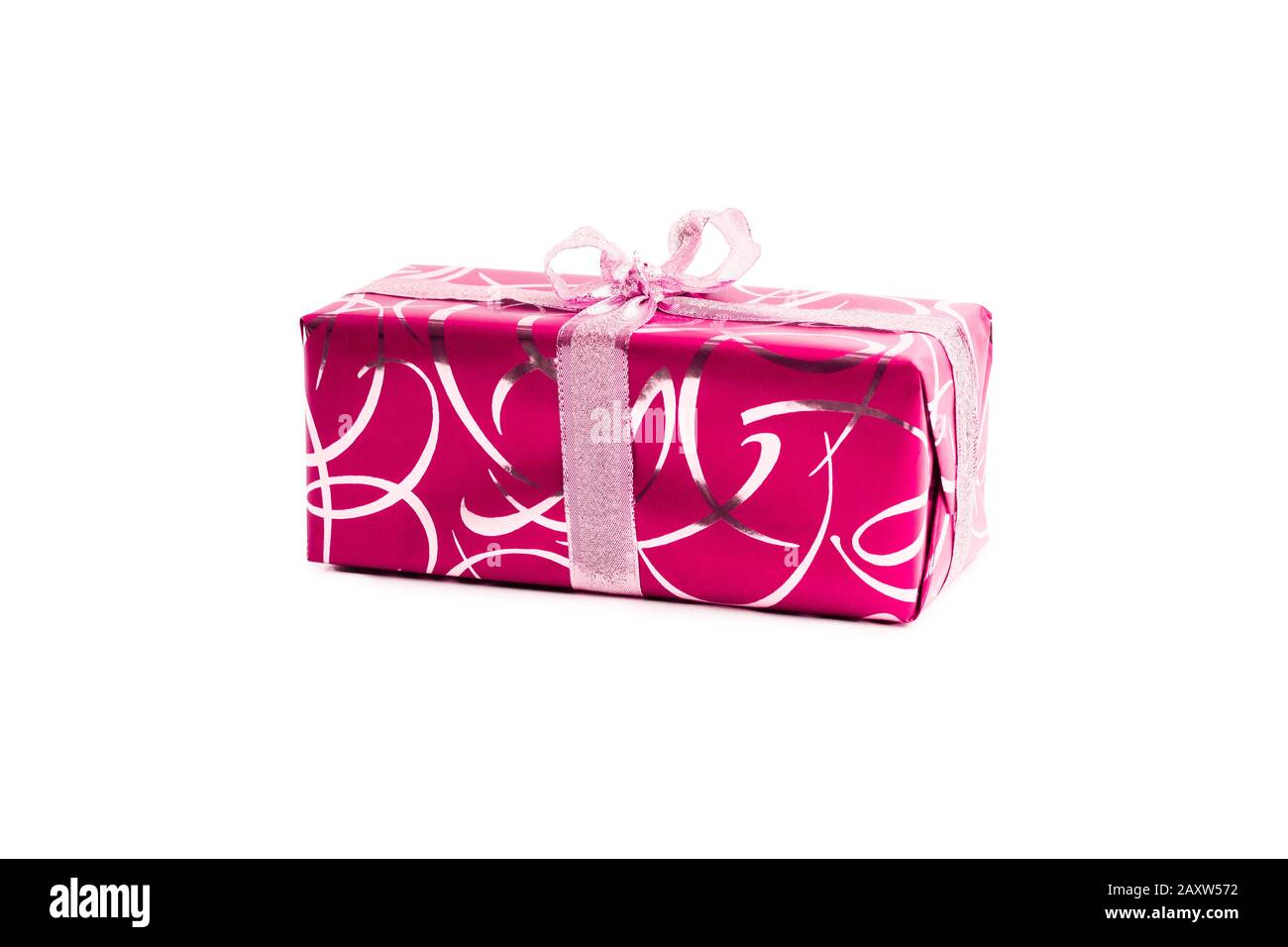 packaged rectangular gift in pink packaging with gold bow and gold pattern on a white background Stock Photo
