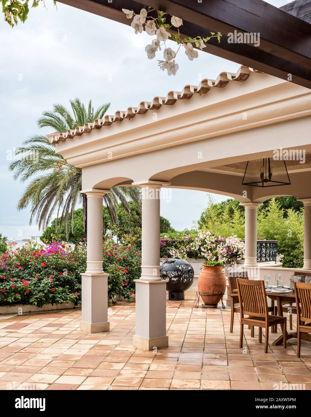 Dining area under cover on patio Stock Photo Alamy