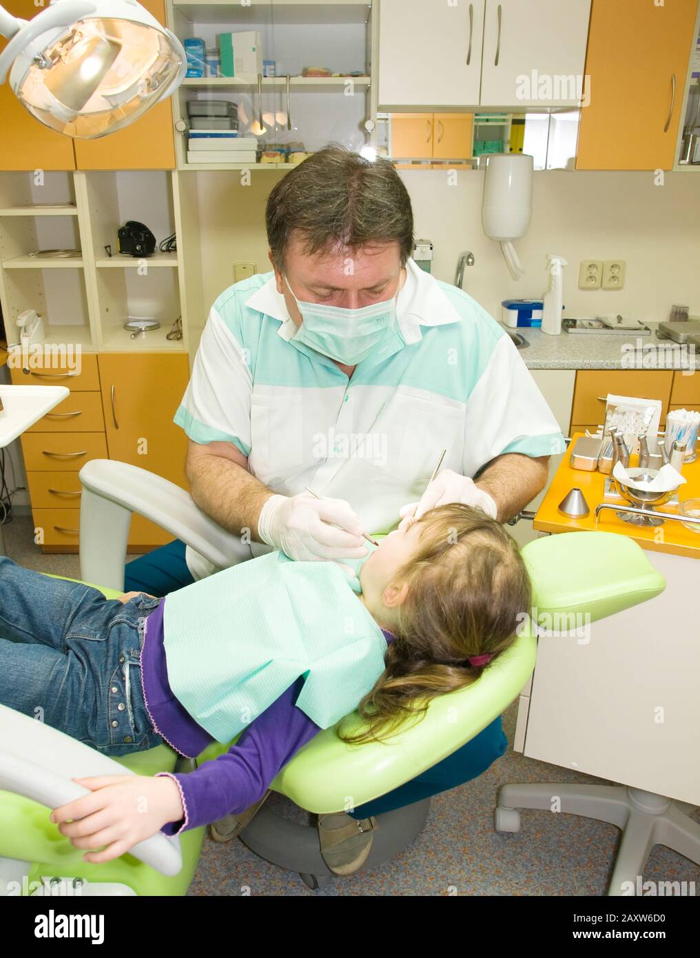 Dentist making prevention examination to little girl Stock Photo Alamy