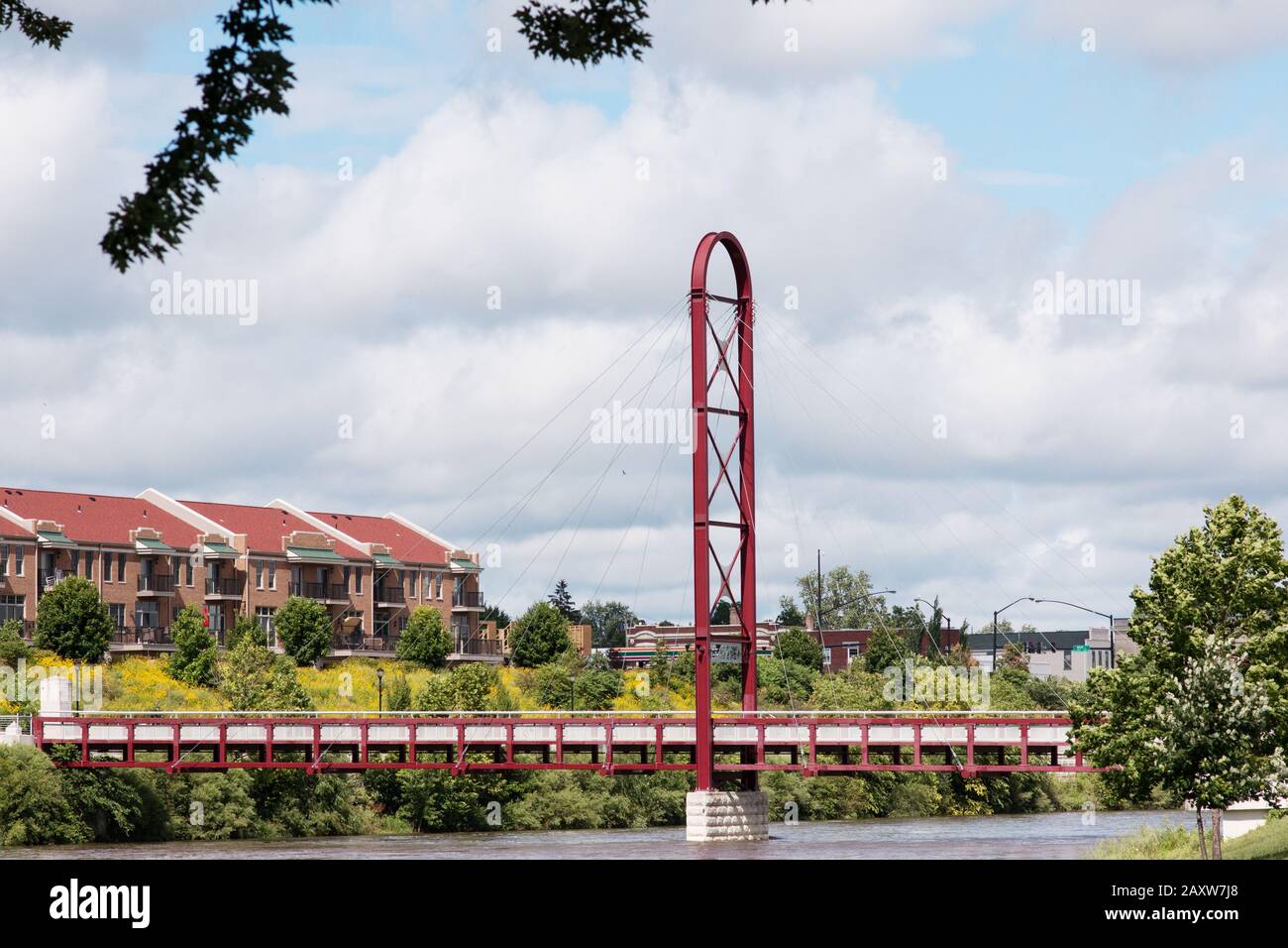 The cable stayed bridge at the Riverwalk connects Beutter and Battell Parks over the St. Joseph River in Mishawaka, Indiana, USA. Stock Photo
