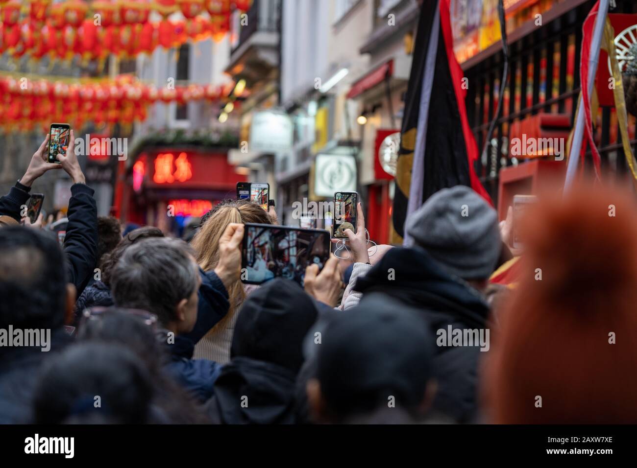 people on the street taking photographs with their smartphone during the chinese new year Stock Photo