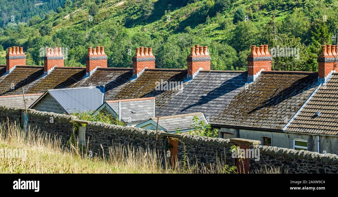 Row of red chimney pots on terraced houses in Clydach Vale, Rhondda, South Wales Stock Photo