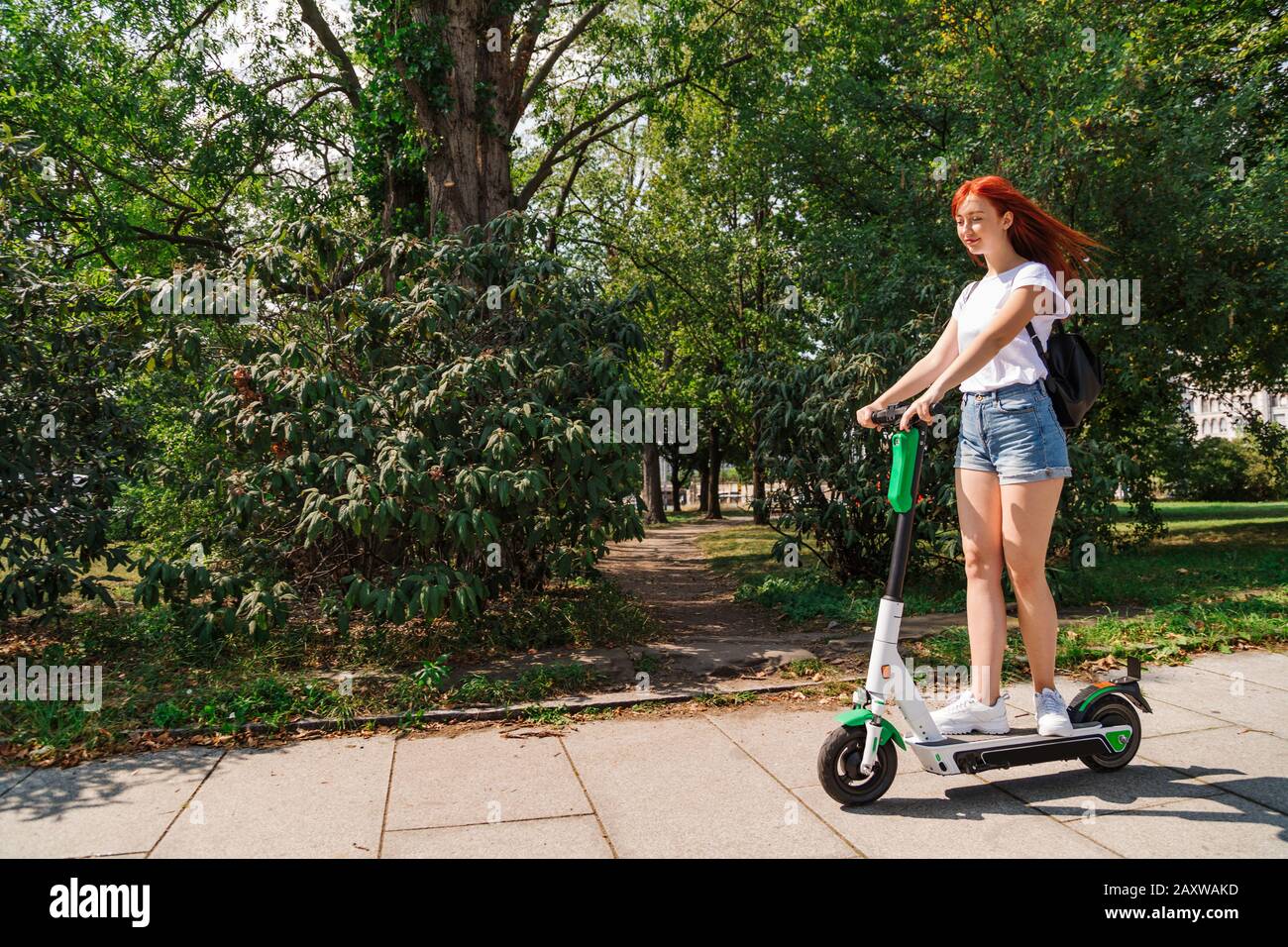 Female rides electric scooter hi-res stock photography and images - Alamy