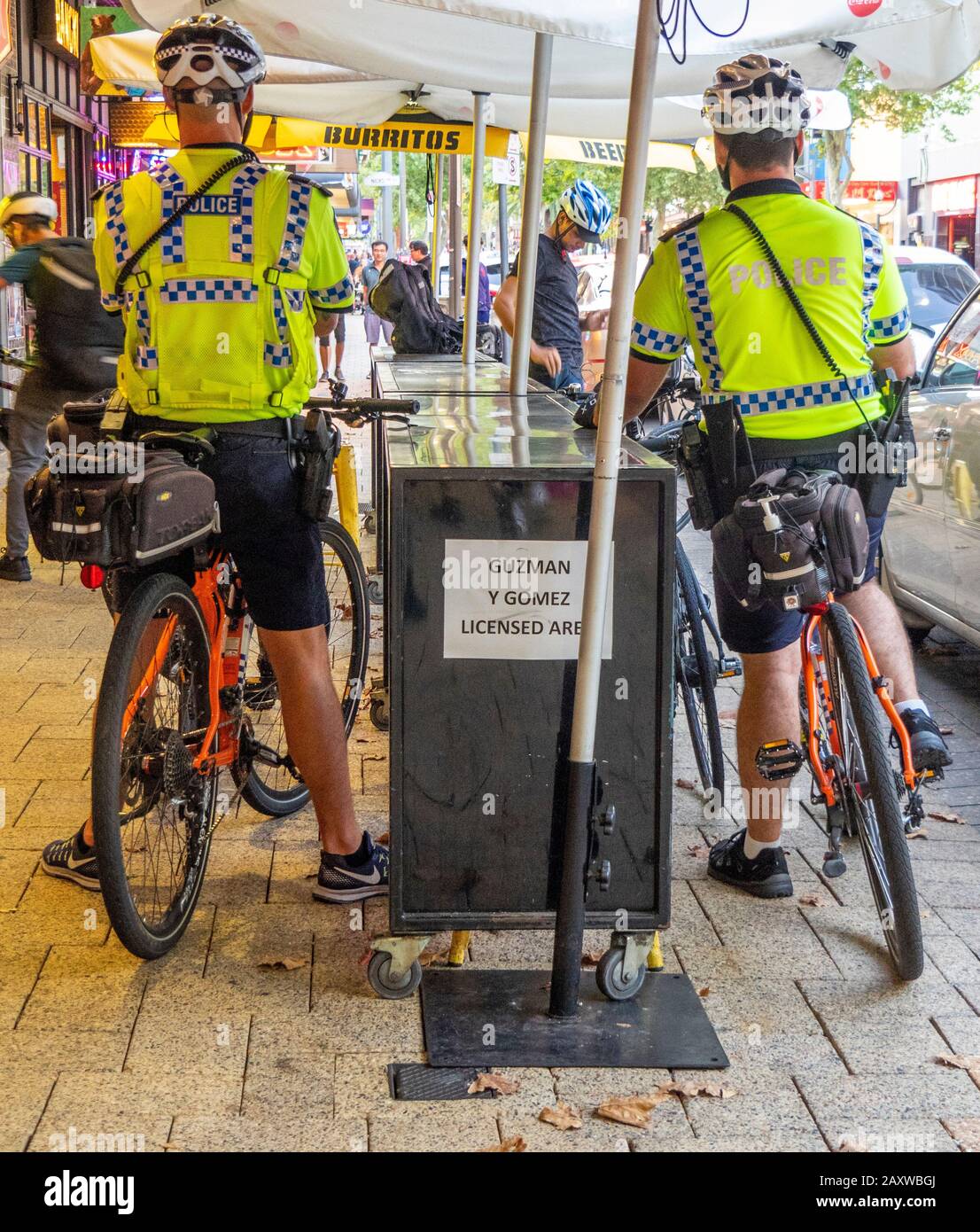 Two policemen from the Bike Squad on patrol in Northbridge Perth WA Australia. Stock Photo