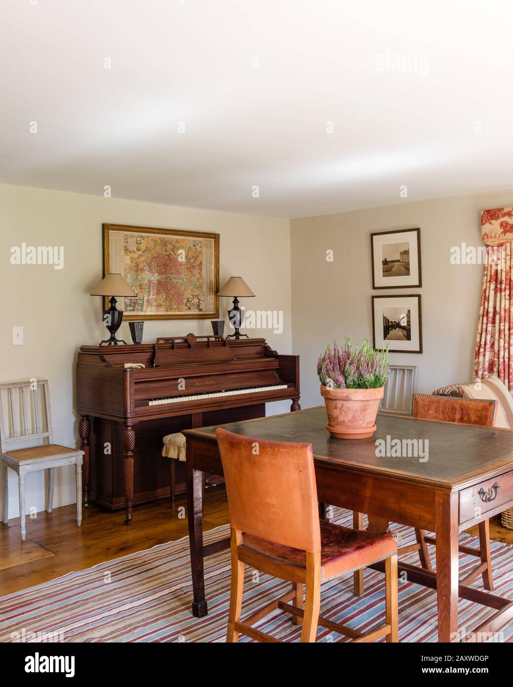 Desk and piano in country style room Stock Photo