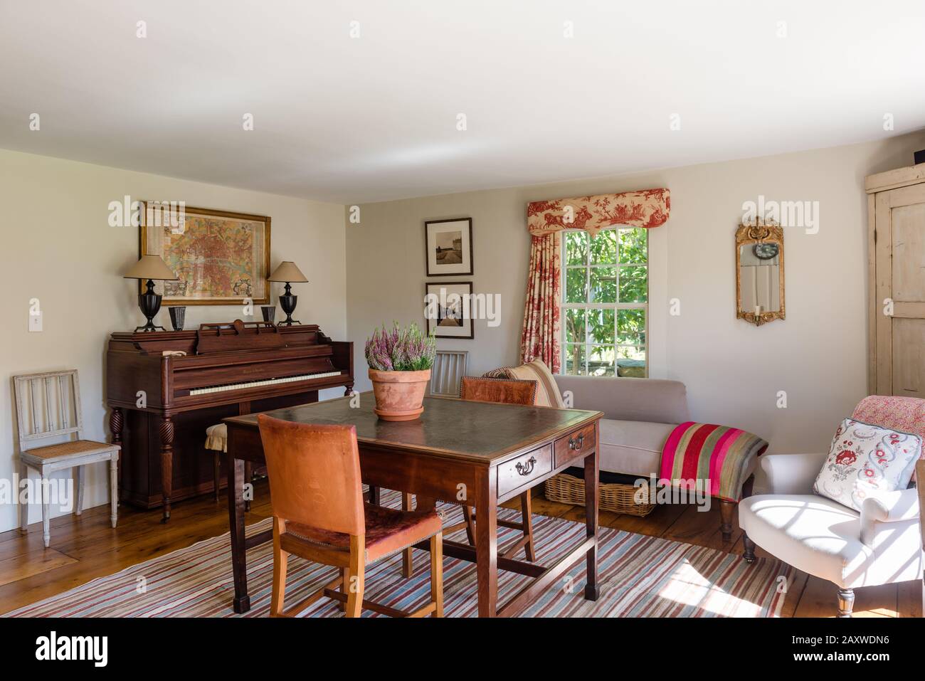 Desk and piano in country style room Stock Photo
