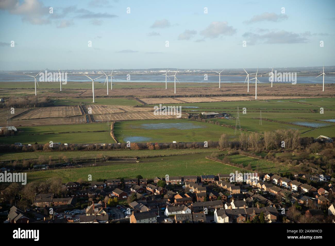 Frodsham, United Kingdom. 09 DEC 2019. Turbines generate electricity from wind power to supply the United Kingdom National Grid with energy at Frodsha Stock Photo