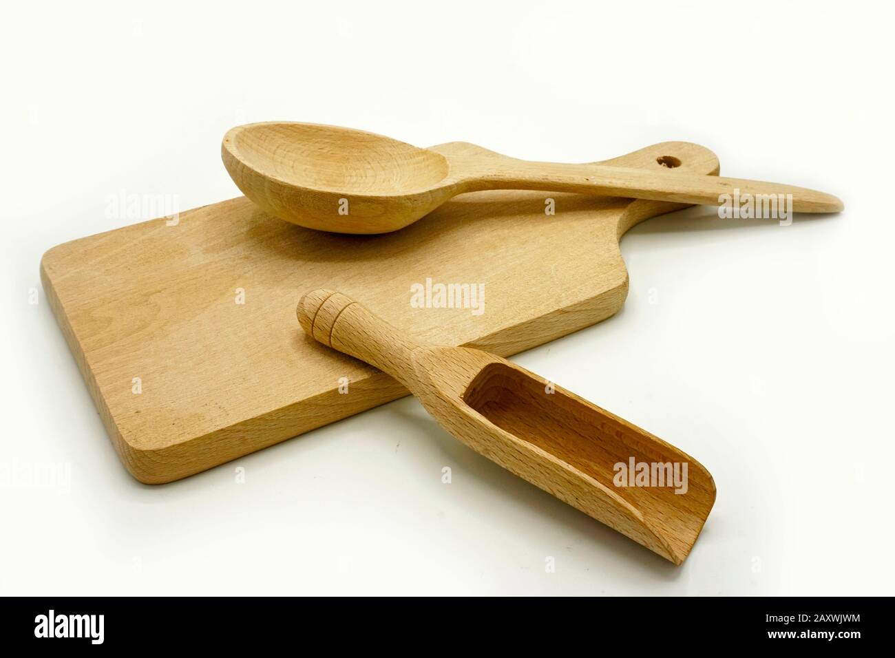 Wooden kitchen utensils on white background. Rustic cutting board ...