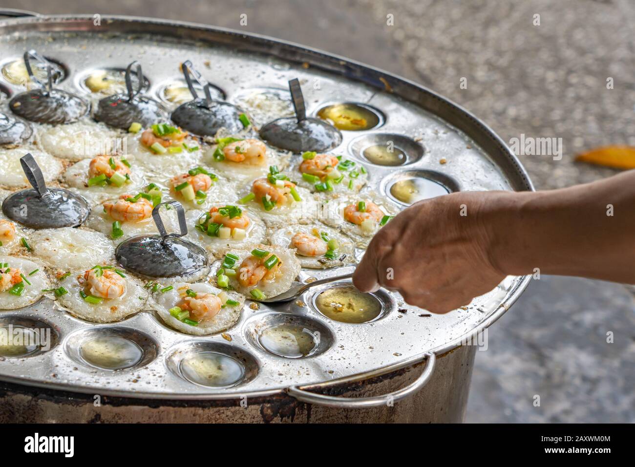 Vietnam traditional mini shrimp pancake at street food market Stock