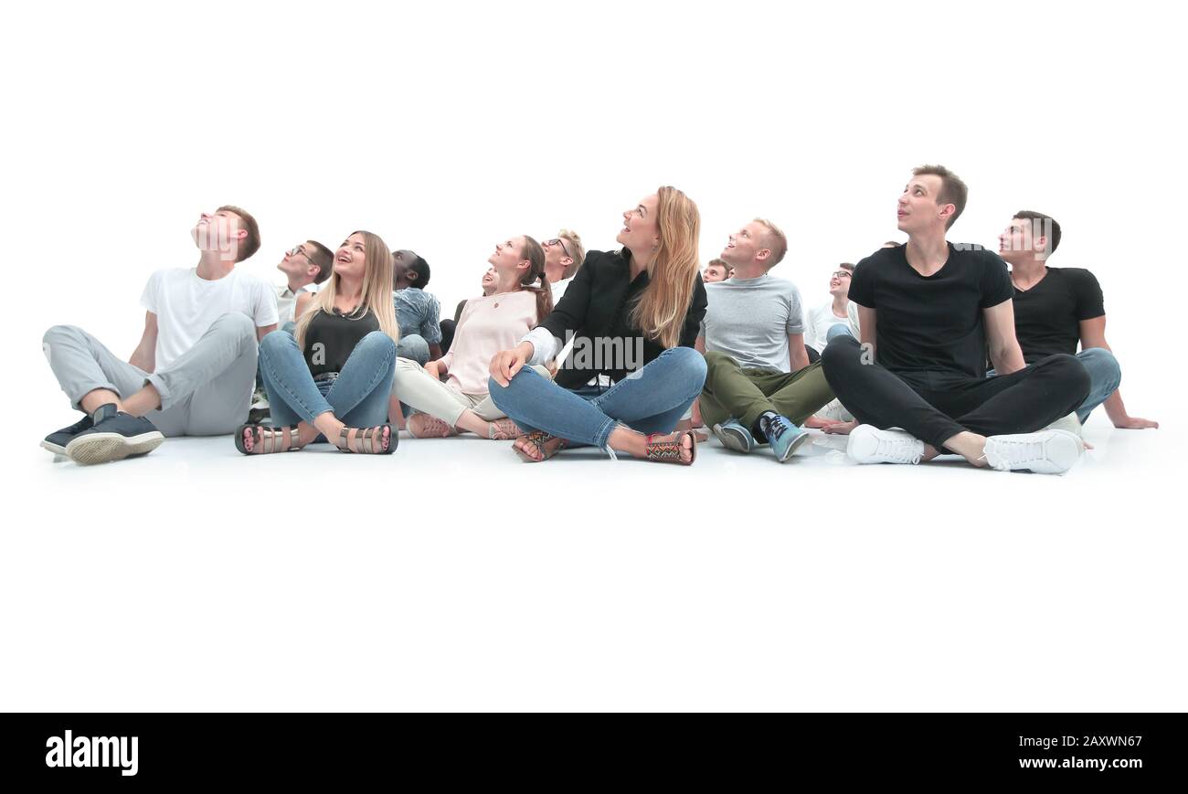 group of young people sitting on the floor in a bright room Stock Photo ...