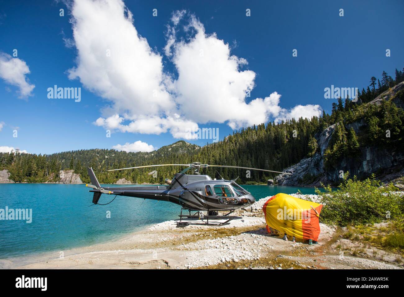 Helicopter patrons test out emergency shelter tent. Stock Photo