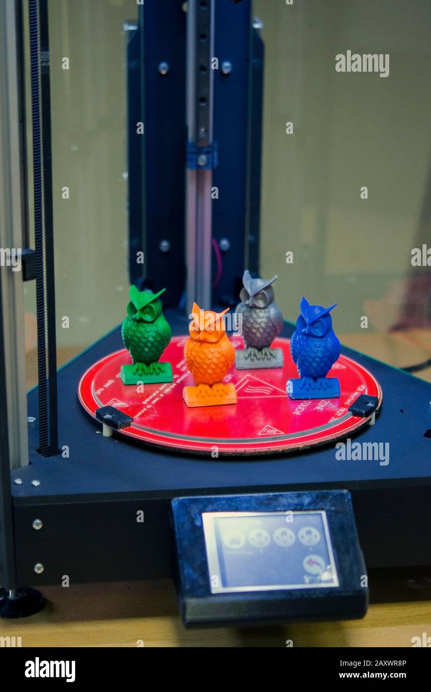 Models in the form of owls stand inside a three-axis 3d printer close-up. Progressive modern additive technologies 4.0 industrial revolution Stock Photo