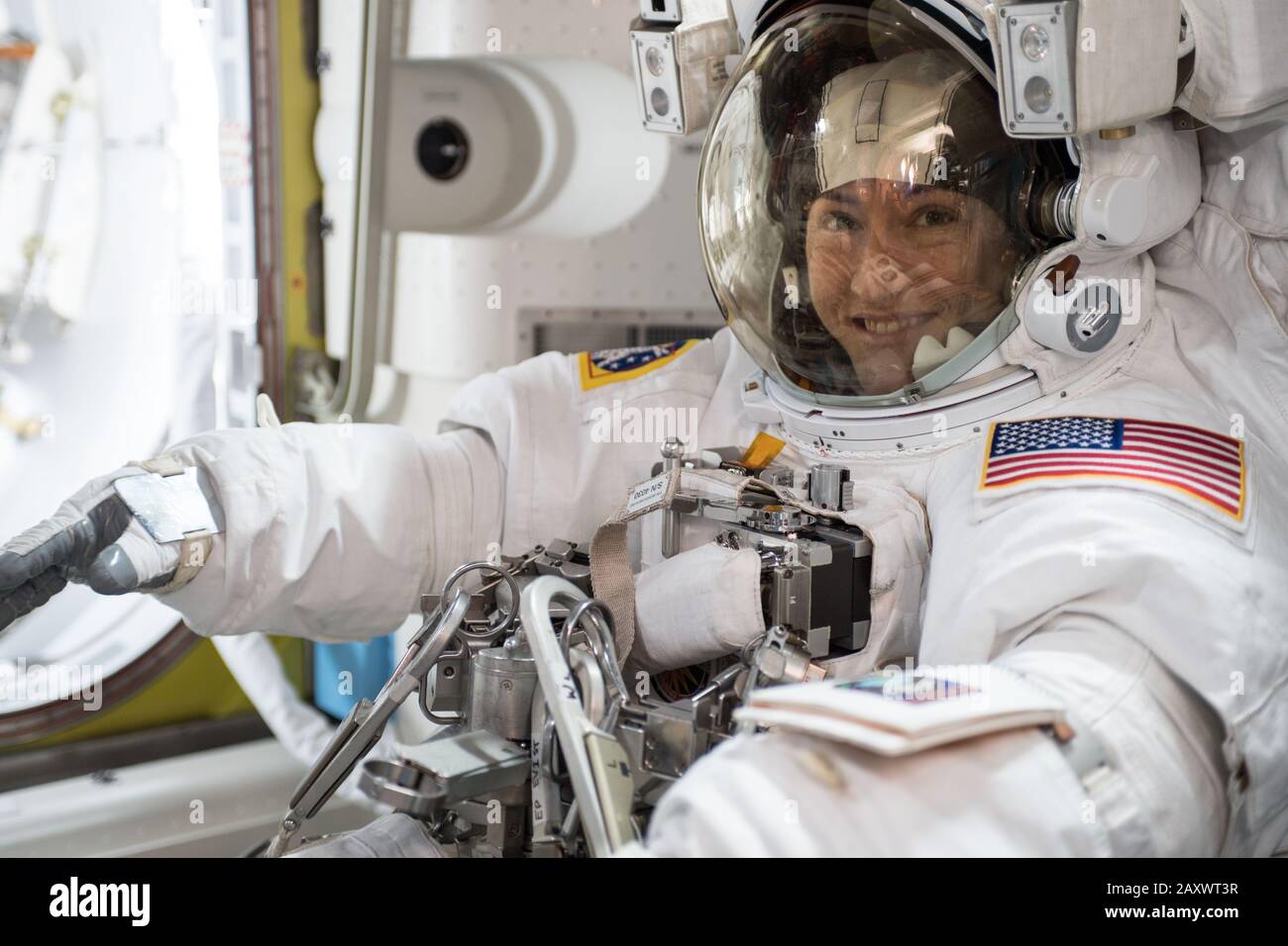 ISS - 6 Oct 2019 - NASA astronaut Christina Koch is suited up in a U.S. spacesuit before beginning a seven hour and one minute spacewalk to upgrade th Stock Photo