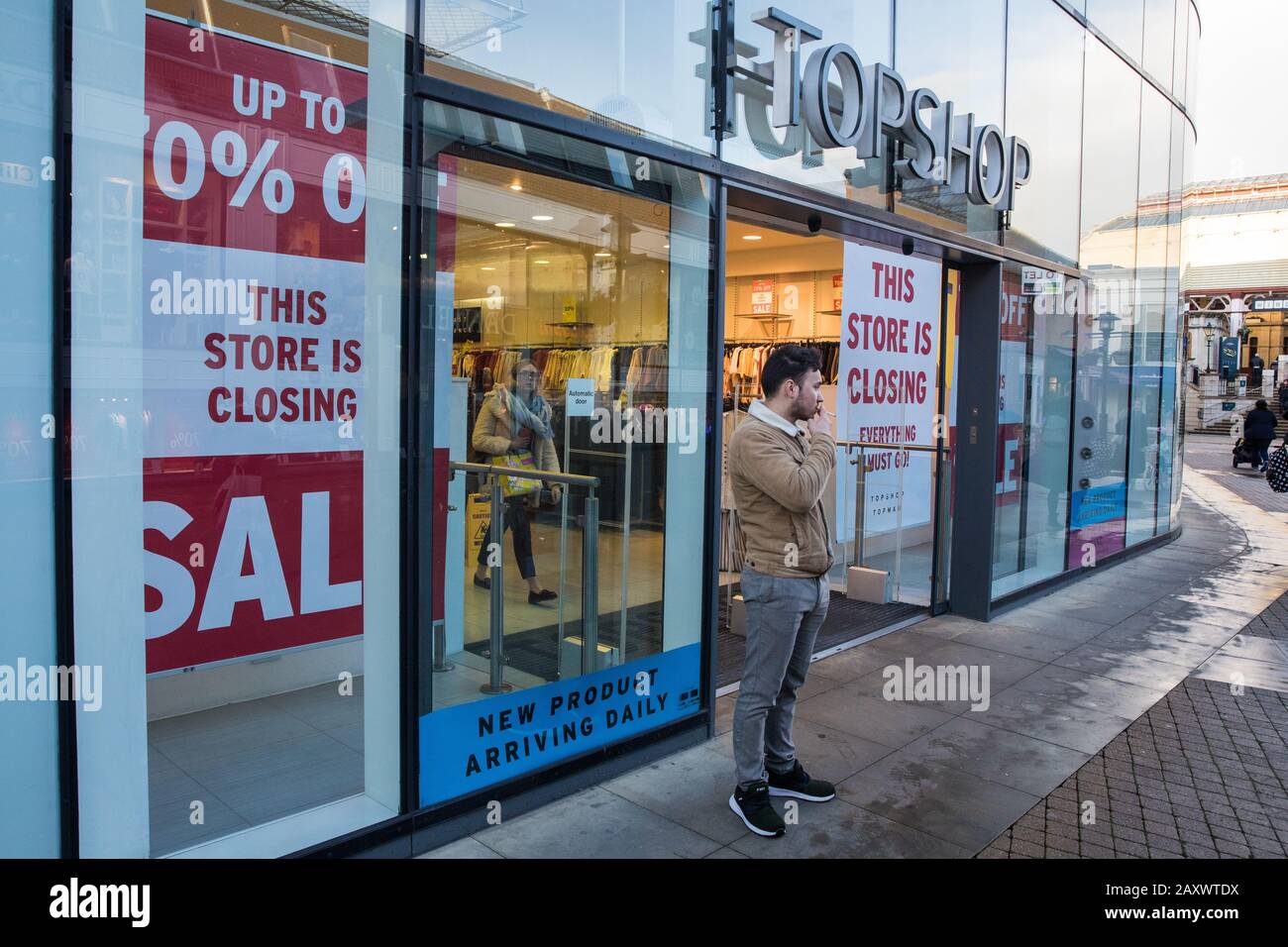 Windsor, UK. 13 February, 2020. A Topshop store in Windsor Yards, a  shopping area in the heart of the historic town, displays closing down  notices. A nearby New Look store is also