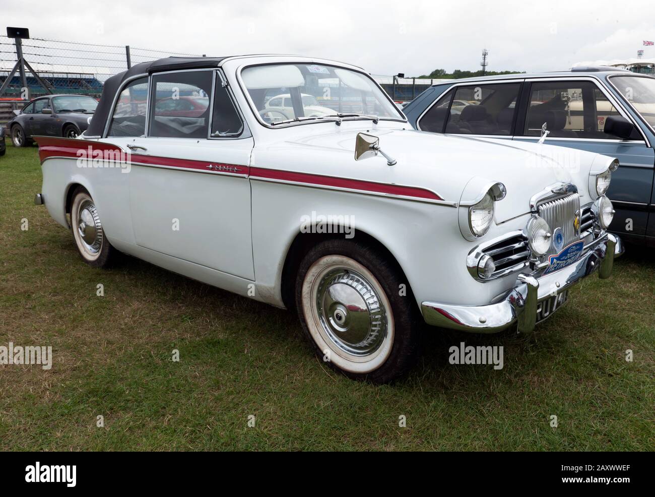 Three-quarter front view of a White, 1959, Sunbeam Rapier Series II, on display at the 2019 Silverstone Classic Stock Photo