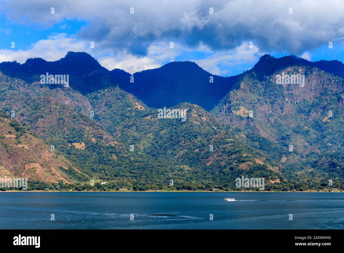 Mountains and clouds sorroundin lake atitlan guatemala Stock Photo Alamy