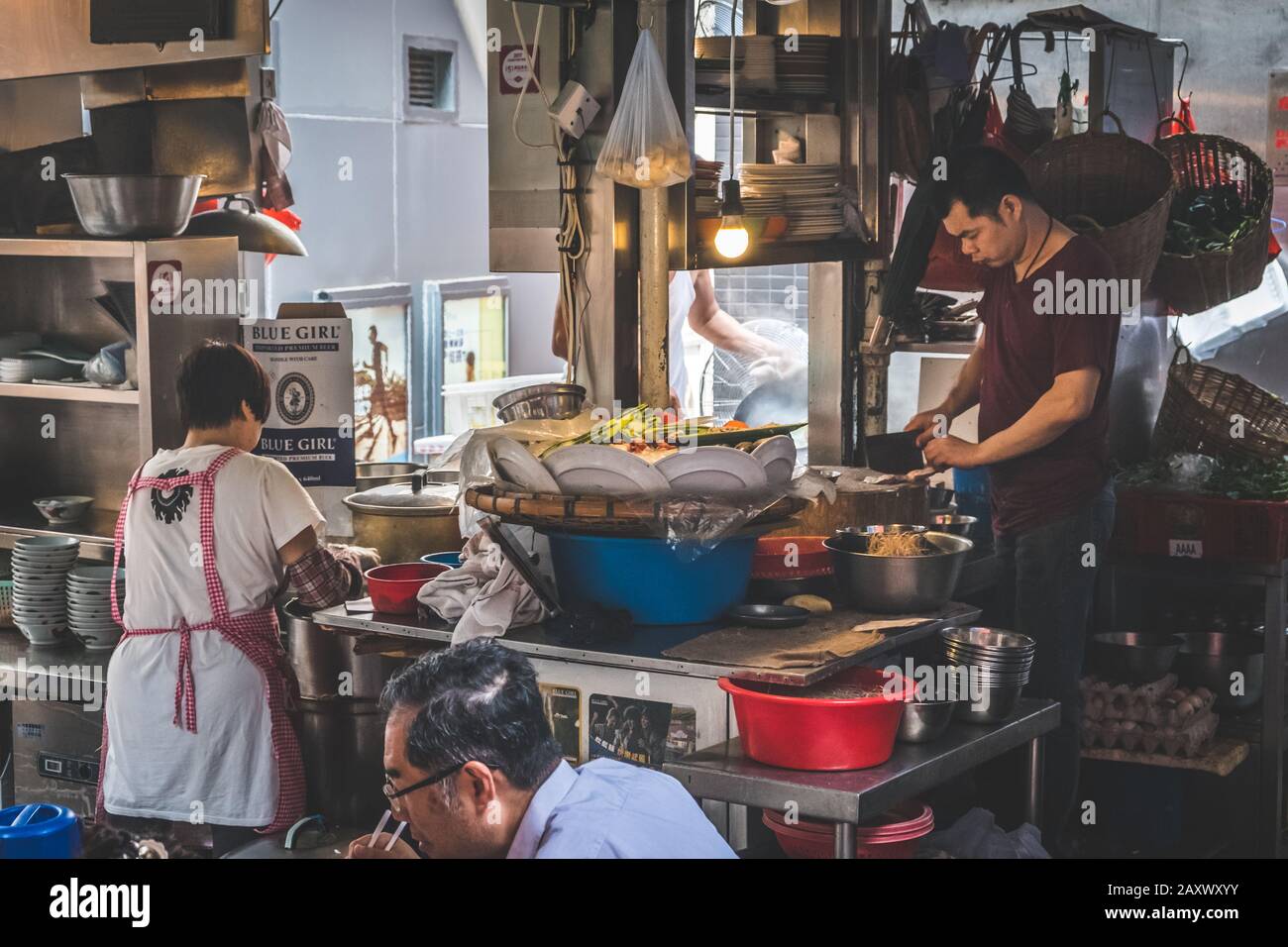 Hong Kong - November, 2019: Outdoor kitchen in street food restaurant   in Soho, Hong Kong Stock Photo
