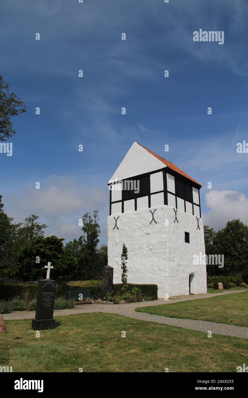 Vertical shot of a beautiful nylars church in aakirkeby, denmark Stock Photo