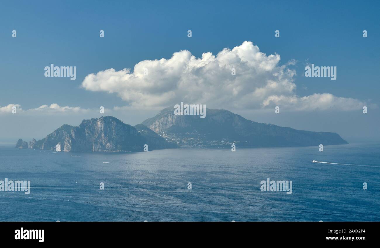 The island of Capri off tip of the Amalfi Coast, Italy creates its own cloud formation. Stock Photo