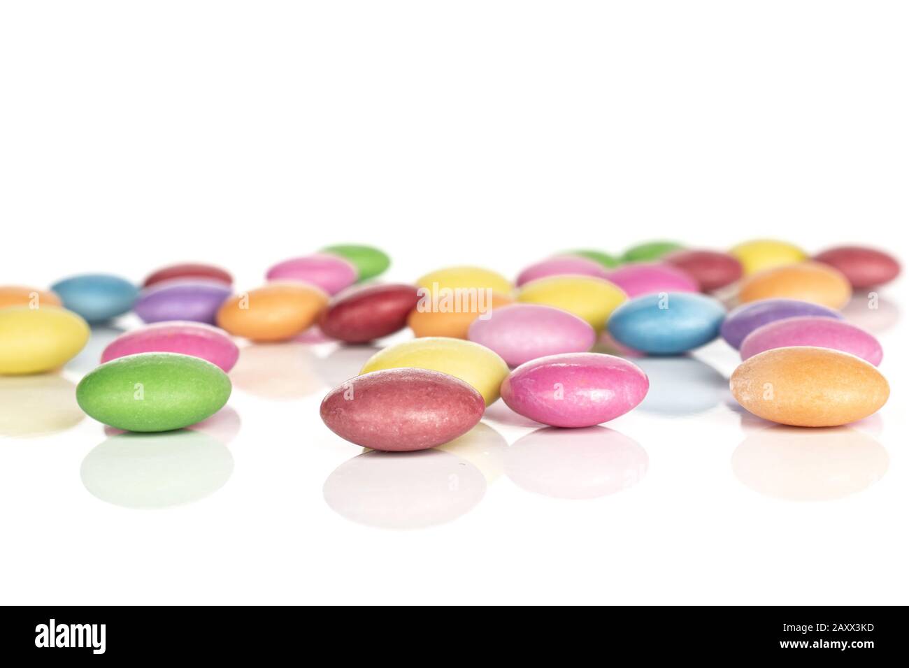Lot of whole disordered sweet colourful candy isolated on white ...