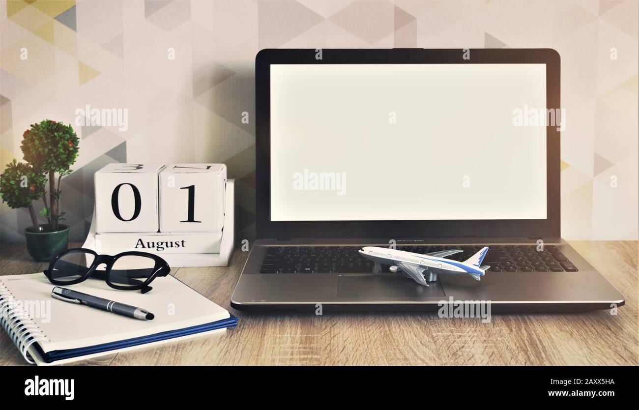 Download Laptop Mockup Home Desk With Decoration Calendar Plant Airplane Model Flight Schedule Concept Vacation Planning Online Stock Photo Alamy