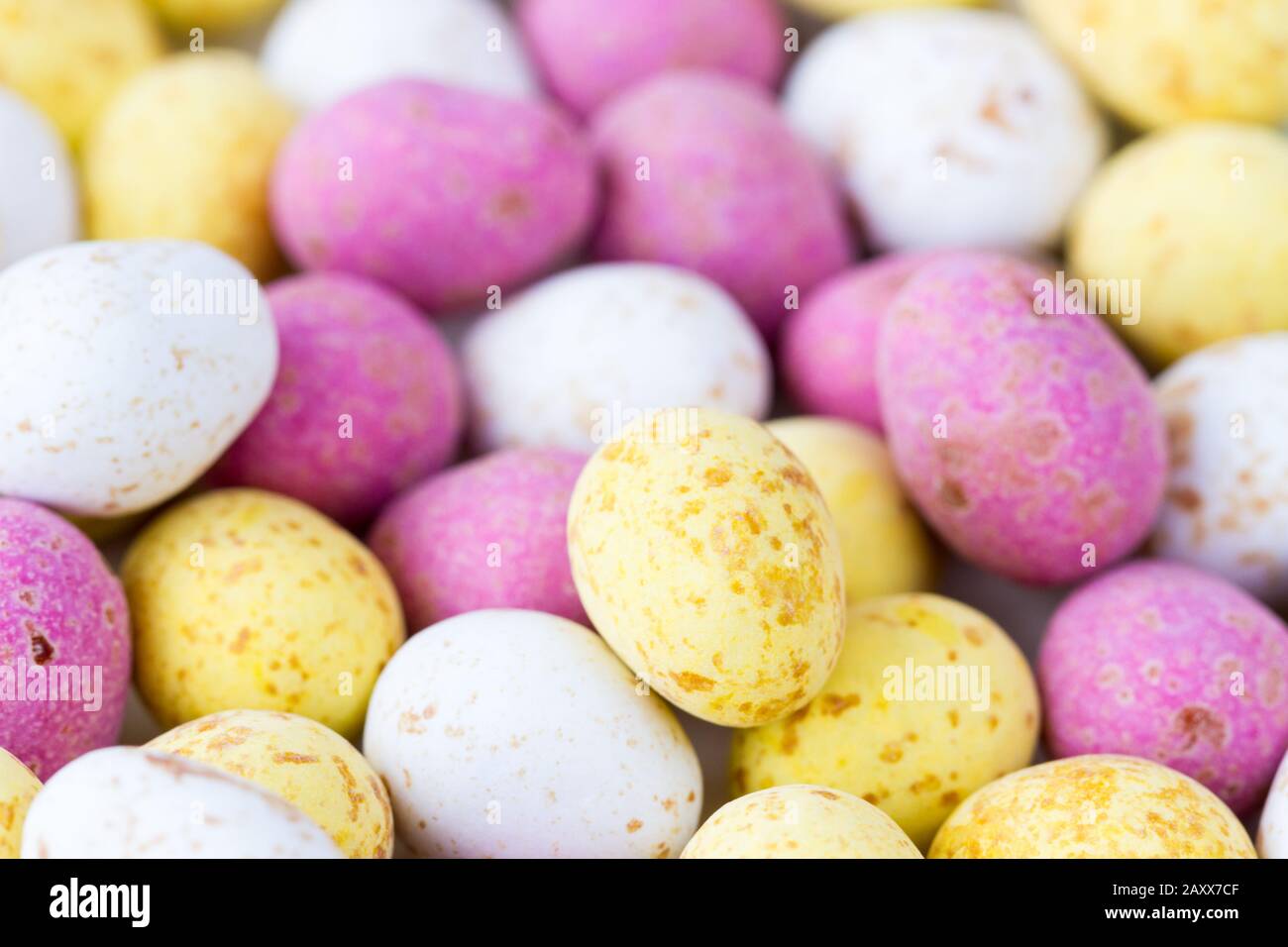 Closeup of some mini colouful chocolate candy covered easter eggs Stock Photo